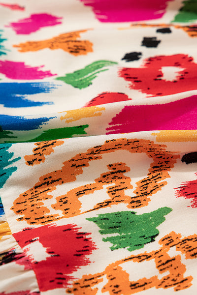 Vibrant Ikat Smocked Mini Dress