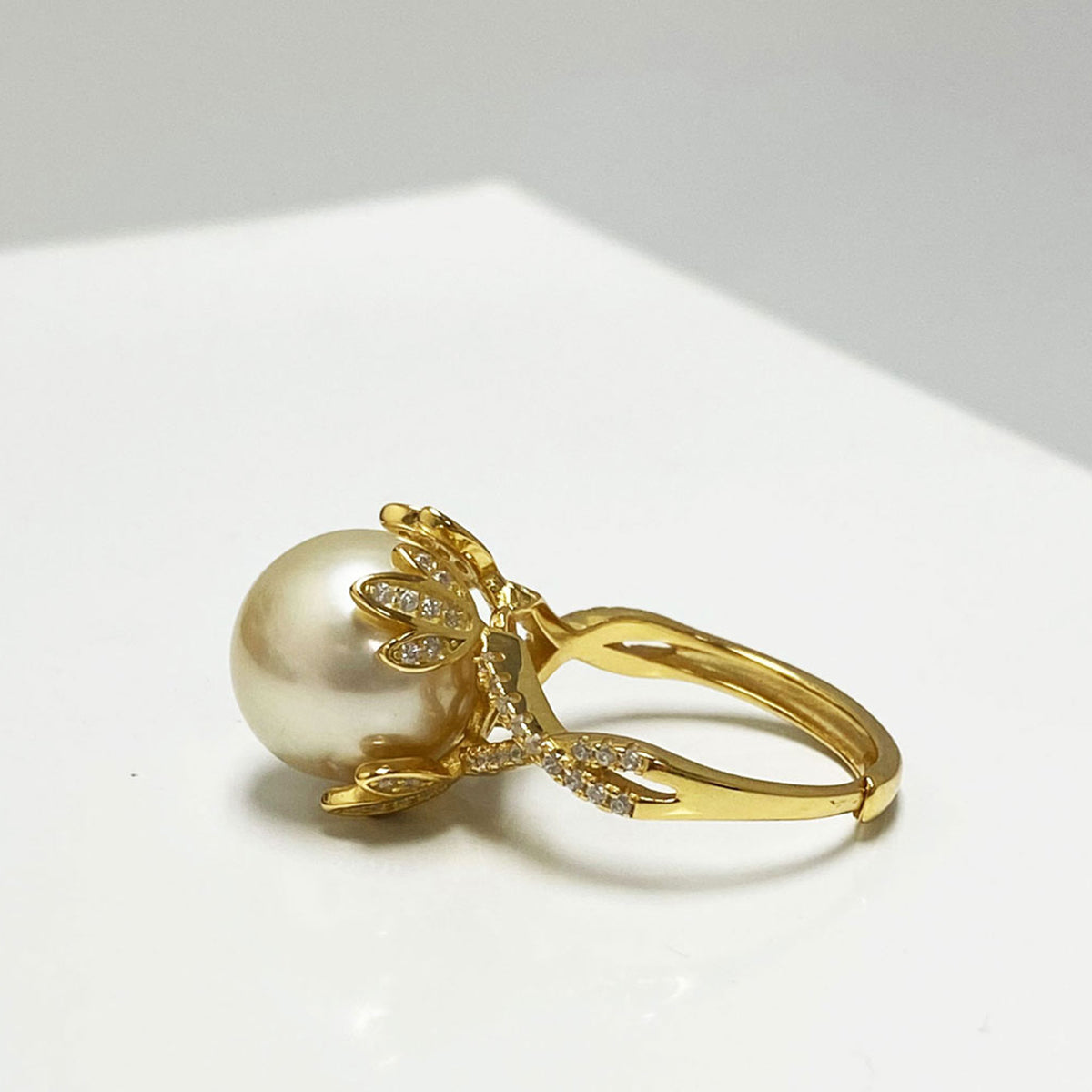 Audrey South Sea Gold Pearl Ring Sitting in a Golden Crown